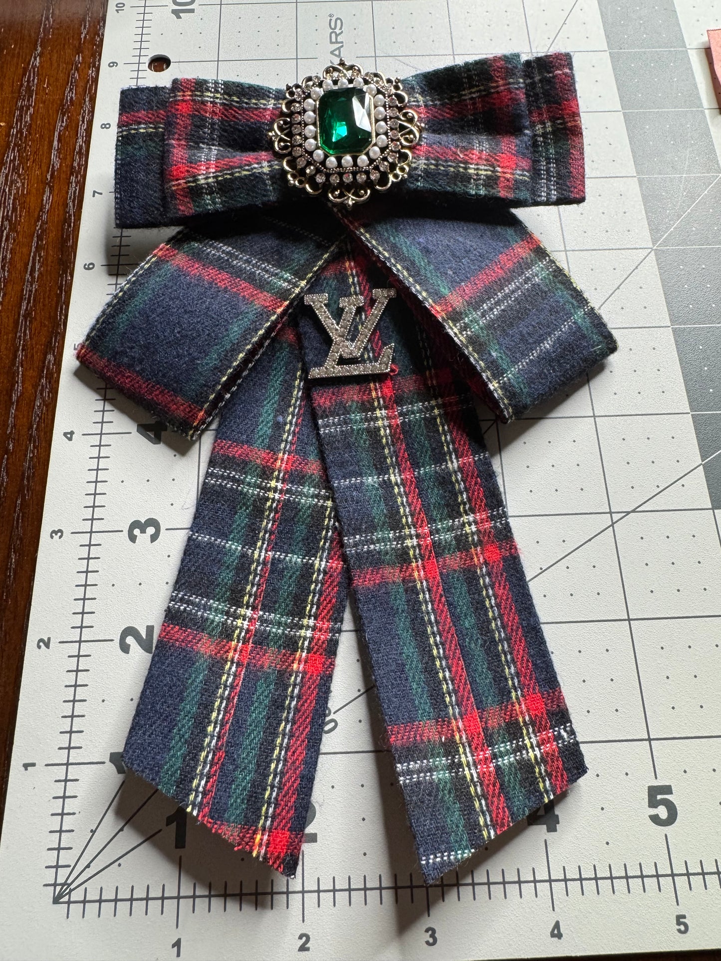 LV bows brooches
