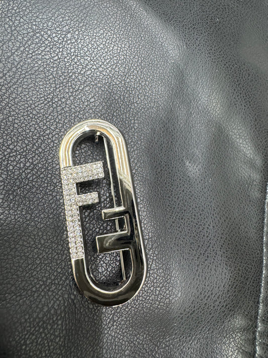 FF brooch